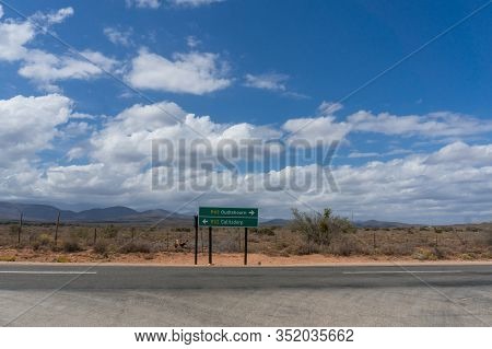 Direction Sign On R62 Highway In South Africa With Directions To Oudtshoorn And Calitzdorp. Little K