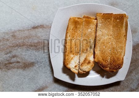Overhead View On Toast Bread In Traditional Chinese Style With Butter And Kaya In Kopitiam