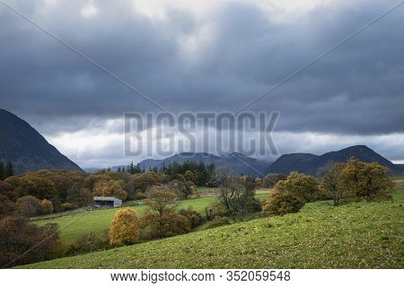 Stunning Autumn Fall Landscape View Along Valley Towards Mellbreak And Grasmoor In Lake District Wit