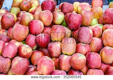 A Bunch Of Whole Ripe Apple In Fruit Market