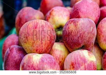A Bunch Of Whole Ripe Apple In Fruit Market