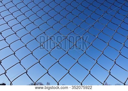 Metal Net With Blue Sky, Iron Fence On A Blue Sky, Mesh Fence, Chain Link Fence Metal Fence And Blue
