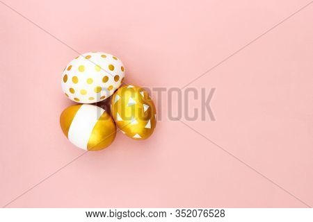 Trendy White Golden Spring Easter Eggs Flat Lay On Colorful Pink Background Top View With Copy Space