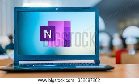 Poznan, Pol - Feb 19, 2020: Laptop Computer Displaying Logo Of Microsoft Onenote Program, Part Of Th