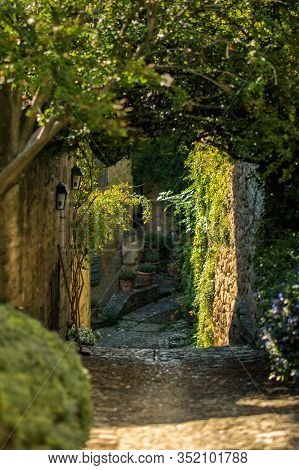 Vertical Landscape Of Old Narrow Street In One Of The Most Beautiful Villages Of France Lacoste, Lub
