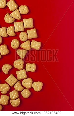 View From Above To Sweet Mini Cookies On The Red Background