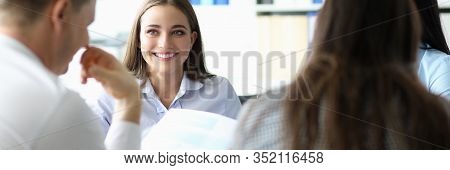 Portrait Of Business Team Discussing New Profitable Project With Colleagues. Cheerful Businesslady S
