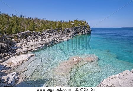 Clear Waters In A Gray Cliffed Cove At Indian Cove In Bruce Peninsula National Park In Ontario