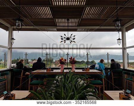 Tabanan Bali, Indonesia - August 24, 2019: A Few Of Visitors Enjoy The Beautiful Scenery While Havin