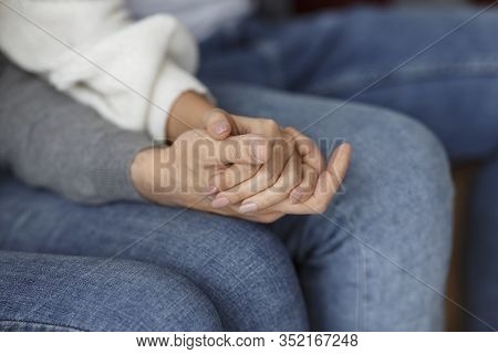 Love And Support. Unrecognizable Spouses Holding Hands Supporting Each Other Sitting On Sofa During 