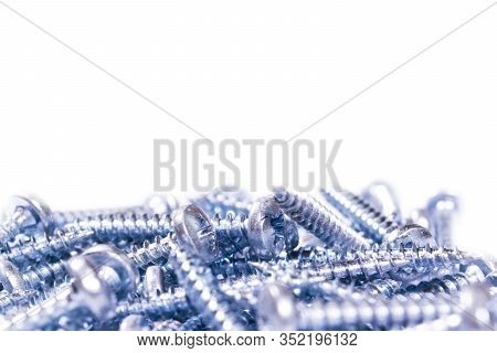 Self Tapping Metal Screw Isolated On White Background. Macro Shot Of A Self-tapping Screws. Backgrou