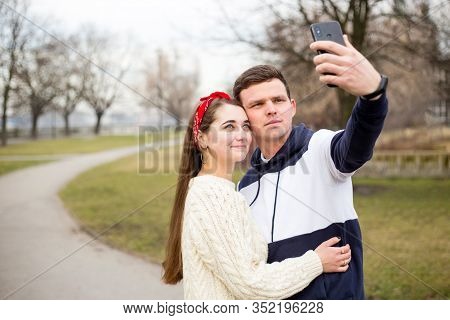 Loving Cheerful Happy Couple Taking Selfie In The City. Capturing Happy Moments Together. Handsome M