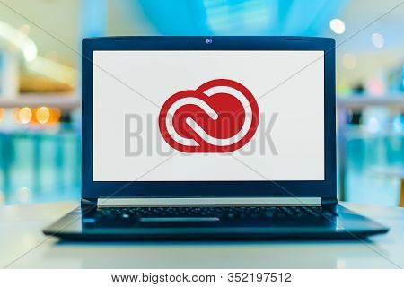 Poznan, Pol - Feb 22, 2020: Laptop Computer Displaying Logo Of Adobe Creative Cloud, A Set Of Applic