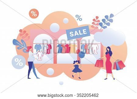 Big Sale With Deep Discounts In Childrens Shop. Expectant Mother Picking Romper Suit For Her Newborn