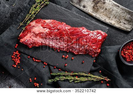 Raw Skirt, Machete Steak With Pink Pepper And Thyme. Black Background. Top View