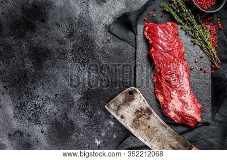 Raw Skirt, Machete Steak With Pink Pepper And Thyme. Black Background. Top View. Copy Space