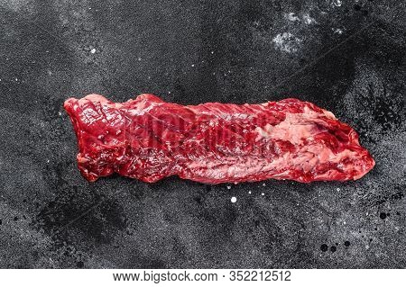 Raw Top Blade, Denver Steak. Black Background. Top View. Copy Space