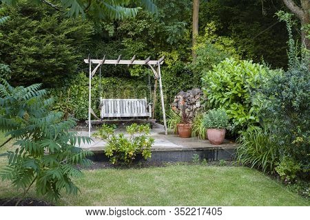 Back Garden And Patio With Furniture In A British Home, Uk