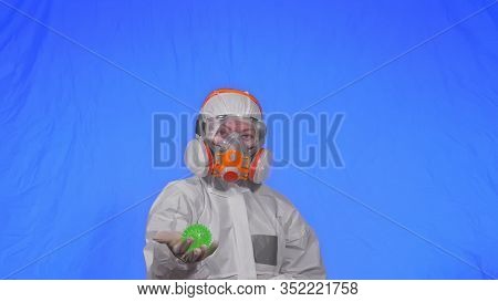 Doctor In Respirator Show A Virus Model. Slow Motion. Woman Wearing Protect Medical Aerosol Spray Pa
