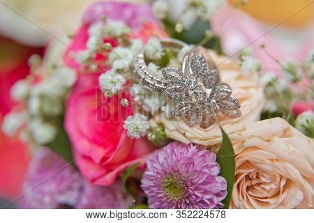 Close Up Wedding Ring On Top Of A Colorfull Bouquet. . Macro .close Up Of Wedding Rings On The Bouqu