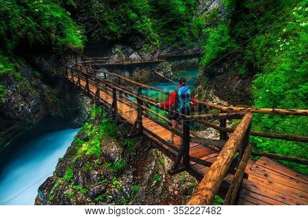 Active Backpacker Hiker Woman On The Wooden Footbridge Enjoying The View, Vintgar Gorge, Slovenia, E