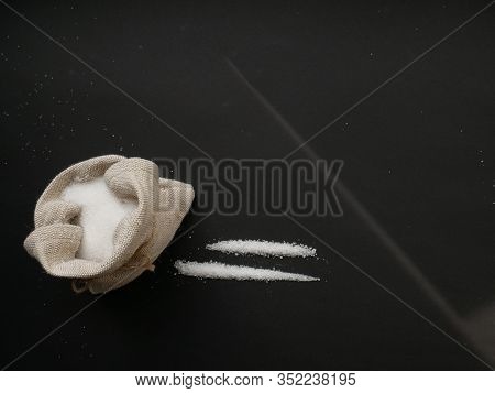 Sugar Looks Like Cocaine Divided Into Paths On A Black Background. Sugar Addiction Concept