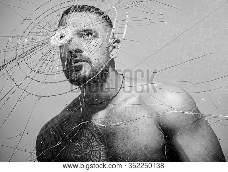 Power And Vitality. Latino Man Full Of Power And Energy Looking Through Broken Glass. Strong Hispani