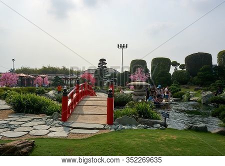 Saigon, Vietnam - December.12.2020: Group Of People Feeding Koi Fishes At Rin Rin Park In Saigon.