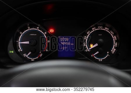 Novosibirsk, Russia - January 24, 2020:  Lada Priora, Dashboard Of The Car Is Illuminated By Bright 