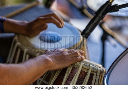 A Close Up Selective Focus Shot On The Hands Of A Drummer Playing Traditional Madal, Maadal, Drums D