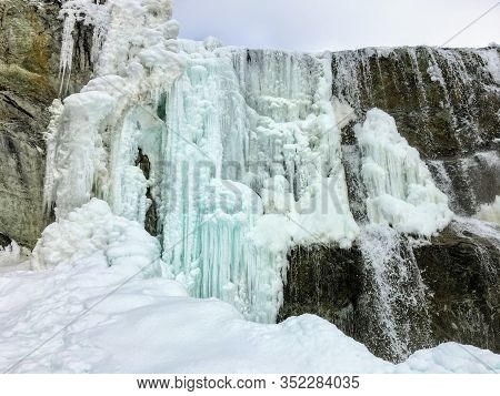 A Beautiful View Of A Frozen Waterfall At Wapta Falls With The Rocky Mountains In The Background, In