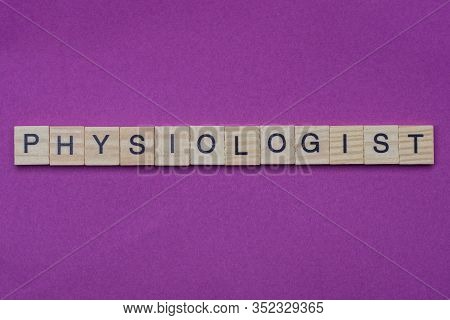 Word Physiologist From Small Gray Wooden Letters Lies On A Lilac Background