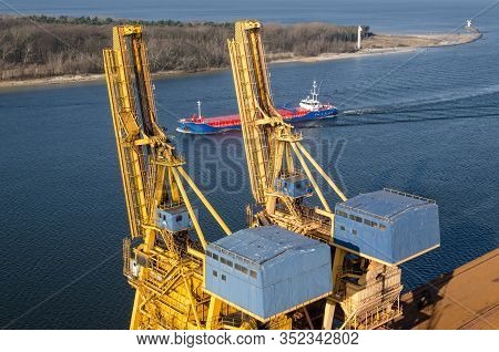 Maritime Transport - The Freighter Flows Through The Port Channel To The Transhipment Quay