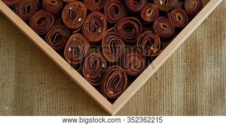 Sweet Pureed Fruit Pastille. Fruit Roll-ups Homemade. Natural Sweets From Dried Berries And Fruits. 