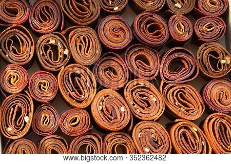Sweet Pureed Fruit Pastille. Fruit Roll-ups Homemade. Natural Sweets From Dried Berries And Fruits. 