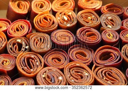 Sweet Pureed Fruit Pastille. Fruit Roll-ups Homemade. Natural Sweets From Dried Berries And Fruits. 