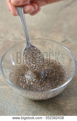 Spoon Of Chia Seed In Bowl Of Water