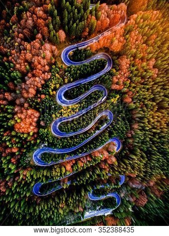 Beautiful Aerial View Of A Curvy Winding Road With Serpentine And Colorful Autumn Trees, Cheia, Dn1a