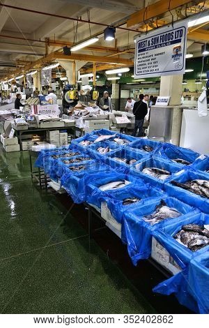 London, Uk - July 8, 2016: Vendors Sell Sea Food At Billingsgate Fish Market In London, Uk. The Mark