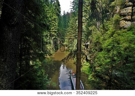 The Kirnitzsch River With Tiny Boat Floating Through The Gorge