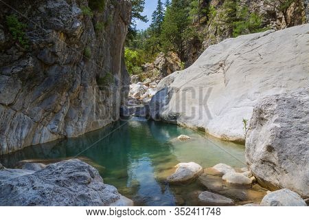 small mountain river with emerald water. Famous Lician Way tourist path in Turkey.