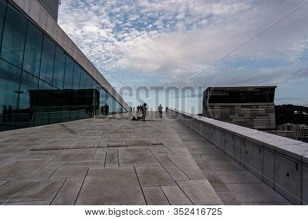 Editorial 08.31.2019 Oslo Norway People Walking At The Opera House And Looking At The Spectacular Ar