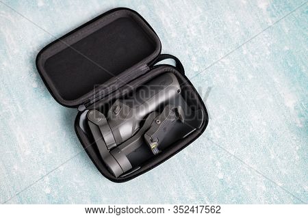 2.02.2020 - Kyiv, Ukraine. Mobile Stabilizer Dji Osmo Mobile 3 For Smart Phone On Isolated Backgroun