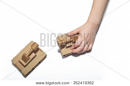 Childrens Hands Play With Tanks. Two Toy Tanks Made By Children From Corrugated Cardboard. Toy Cardb