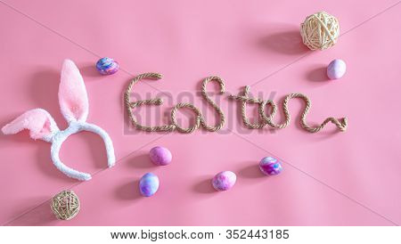 Easter Creative Inscription On A Pink Background .
