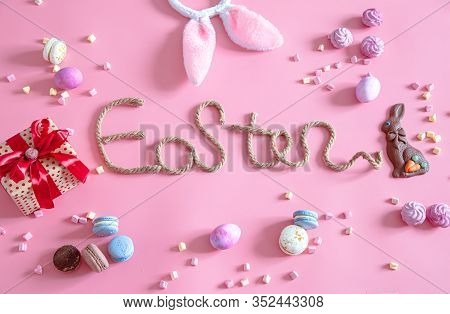 Easter Creative Inscription On A Pink Background .