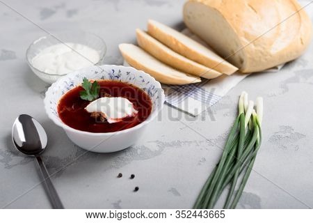 Borsch With Sour Cream, Green Onions And Fresh Bread