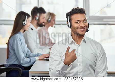 Portrait Of Black Indian Man Pointing At Himself. Call Center Operator Pointing At Himself. Its Me.