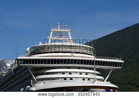 In the marina of famous Flam . Tourism vacation and travel. Mountains landscape and big cruise ship on fjord Sognefjord.June 17,2018. Flam Norway Scandinavia.