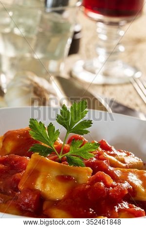 Ravioli With Tomato Sauce On A Plate